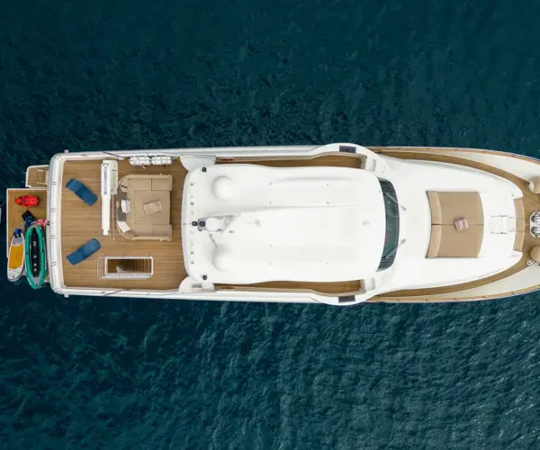 Luxurious Ferretti Custom Line Navetta 26 'La Pausa' yacht seen from above on deep blue sea with seatoys and tender