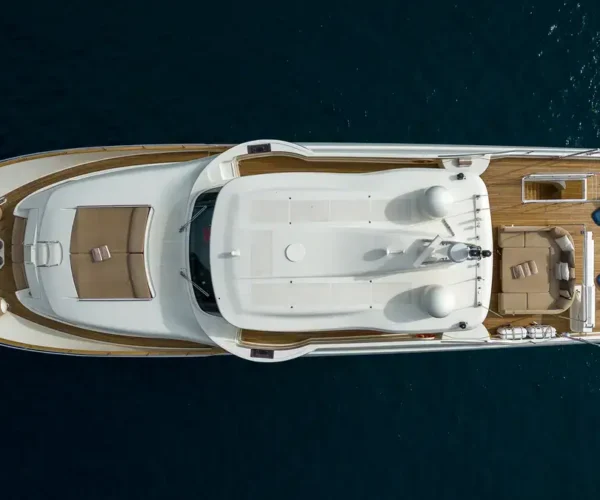 Luxurious yacht of the Ferretti Custom Line Navetta 26 'La Pausa' with teak deck and spacious outdoor lounging areas.