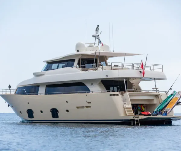 Elegant Ferretti Custom Line Navetta 26 'La Pausa'with water sports equipment on deck for exclusive leisure cruises.