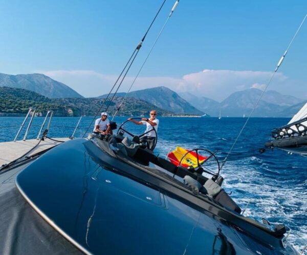 Two people enjoying a day on a luxury yacht in the Mediterranean.